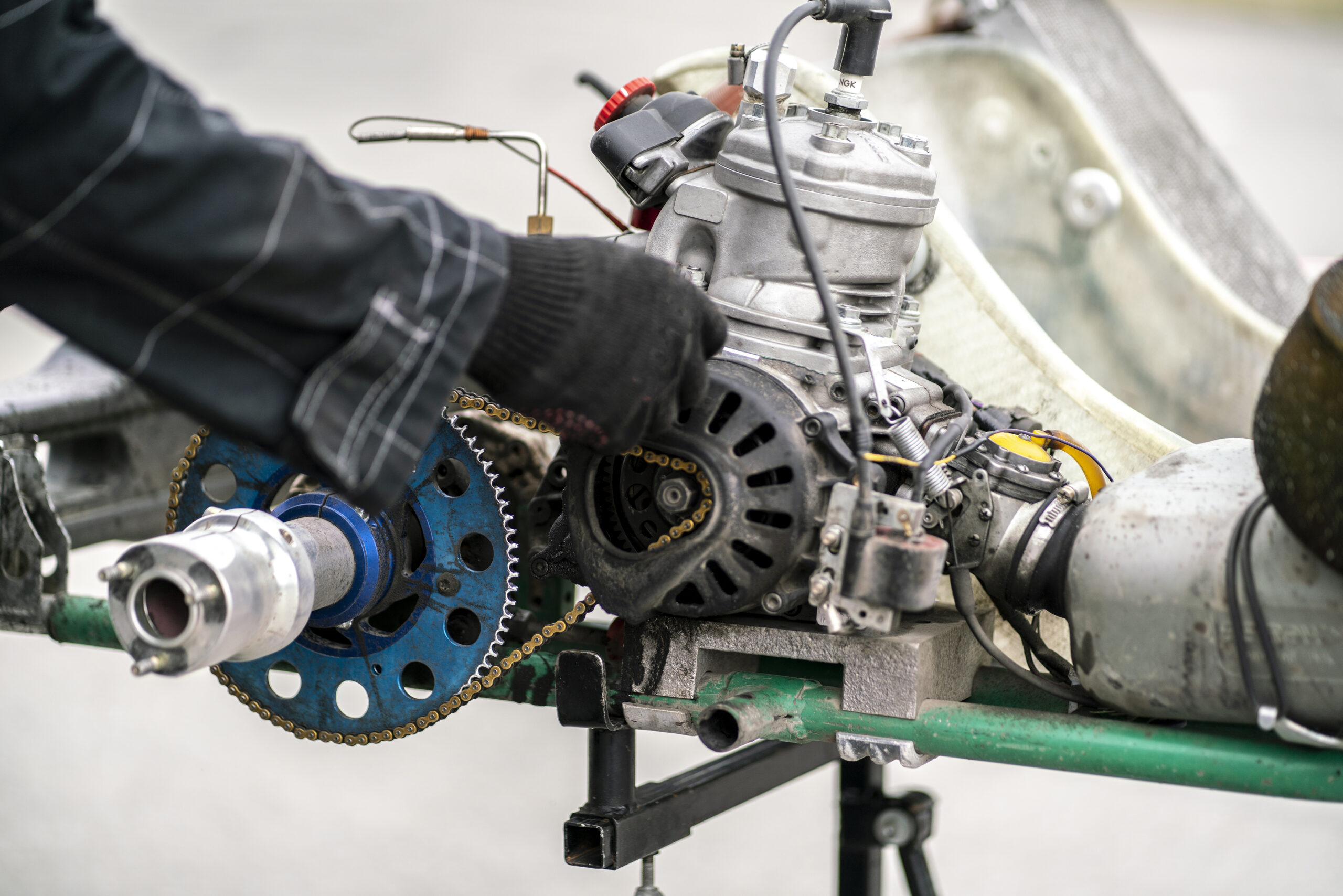 a mechanic repair the karting engine in workshop